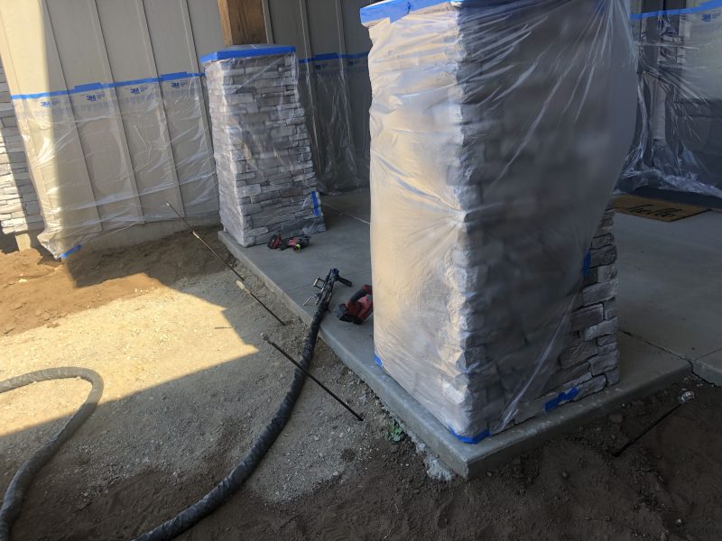 front porch pillars and concrete-entry work (image 8)
