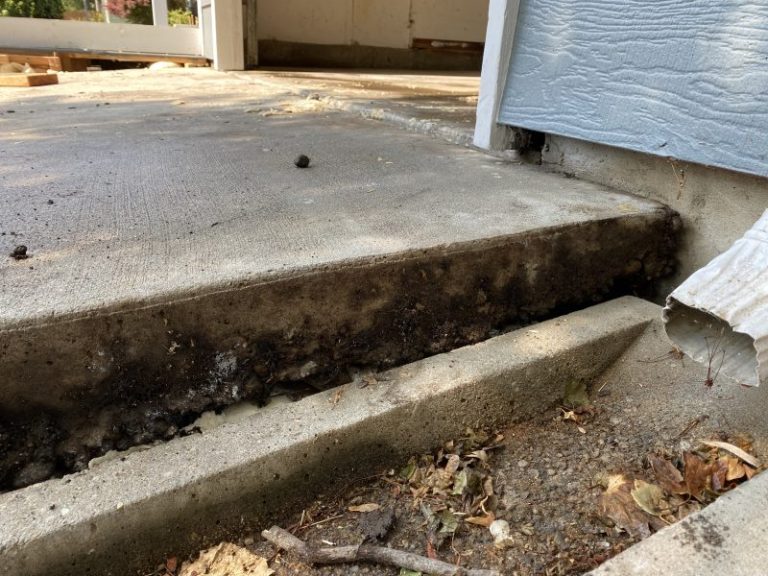 settled garage floor and driveway slab edge (image 8)