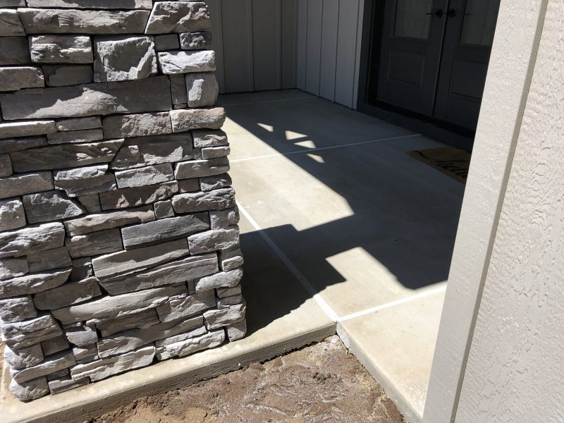 front porch pillars and concrete-entry work (image 5)