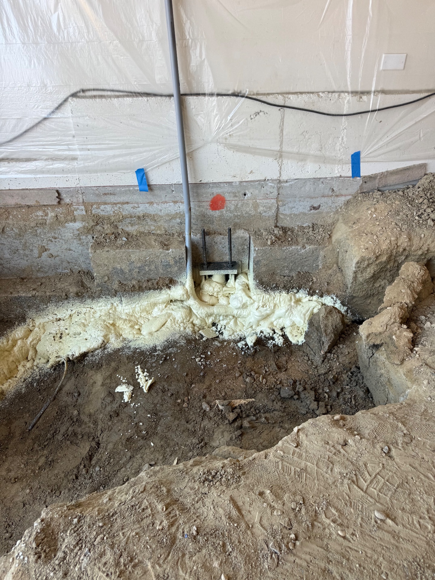 Structural grade foam injected under the lifted footing.