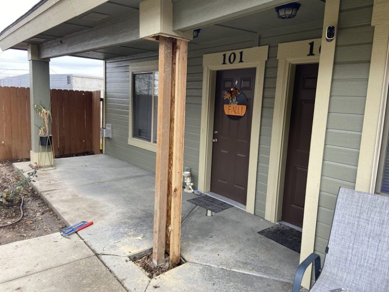 apartment porch pillar and settled concrete repair area (image 5)