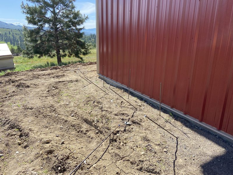 Injection rods laid along the shop foundation perimeter
