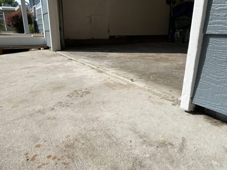 settled garage floor and driveway slab edge (image 6)