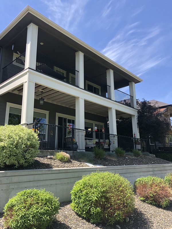 two-story home and covered back patio (image 1)