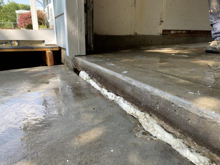 settled garage floor and driveway slab edge (image 2)