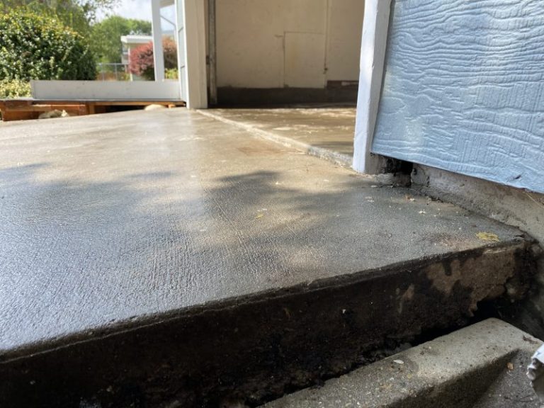 settled garage floor and driveway slab edge (image 7)