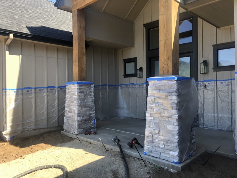 front porch pillars and concrete-entry work (image 9)