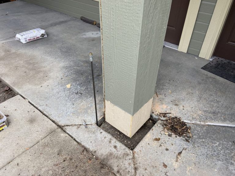 apartment porch pillar and settled concrete repair area (image 8)