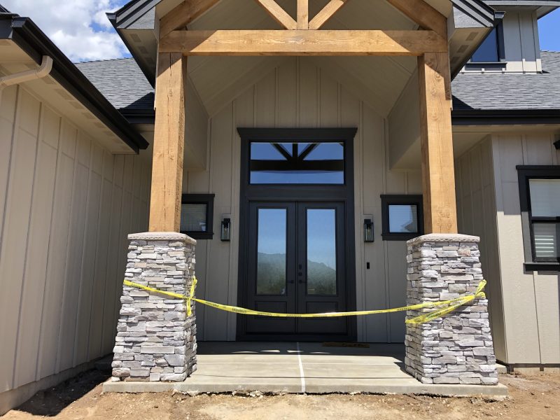 front porch pillars and concrete-entry work (image 2)