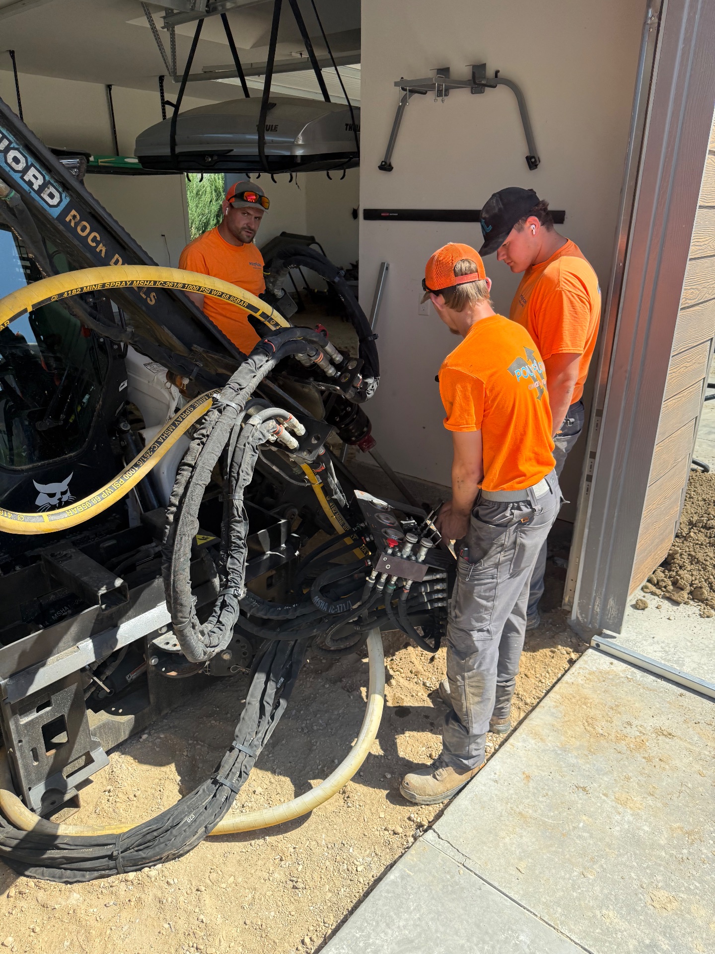 Installing helical tiebacks with our drill rig.