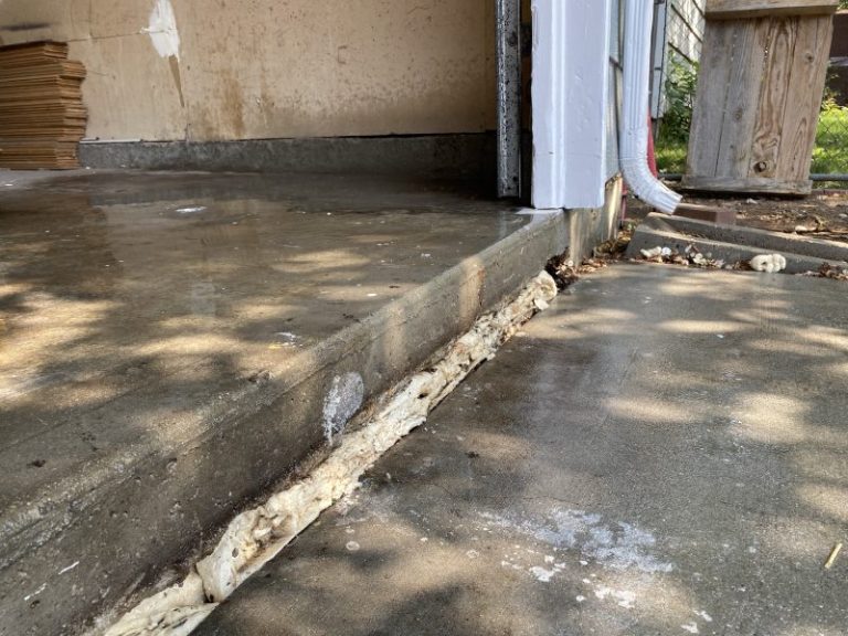 settled garage floor and driveway slab edge (image 3)