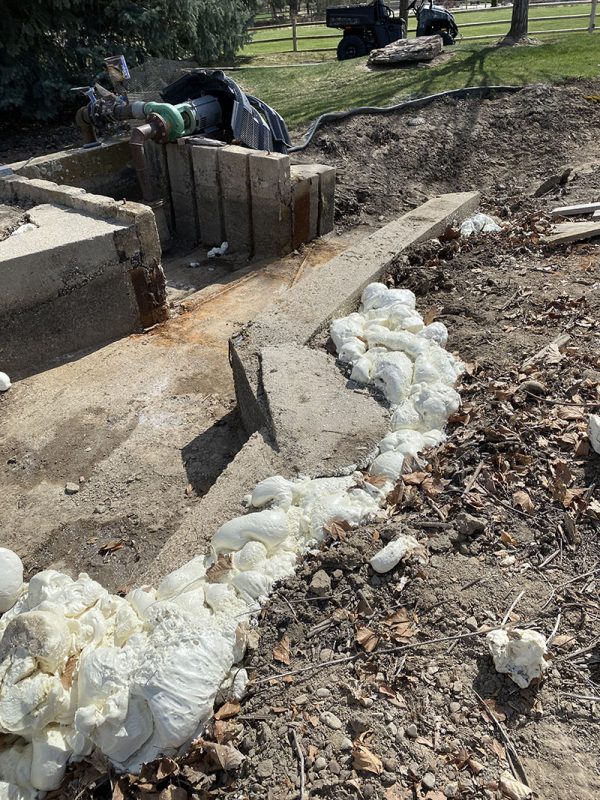 weir-area washout and void-fill work (image 1)
