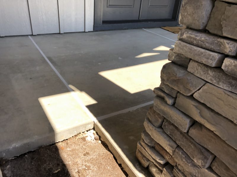 front porch pillars and concrete-entry work (image 4)