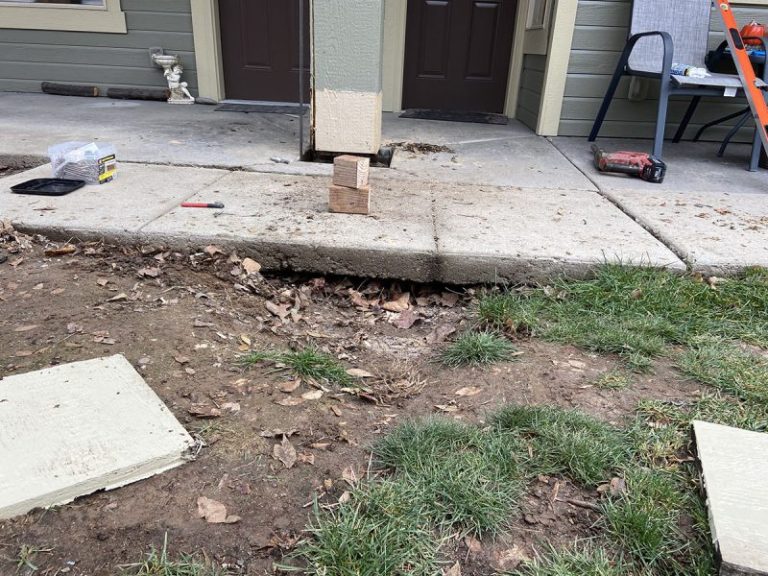 apartment porch pillar and settled concrete repair area (image 4)