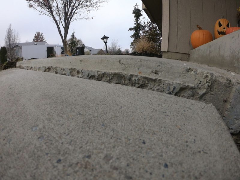 settled residential sidewalk panels (image 1)