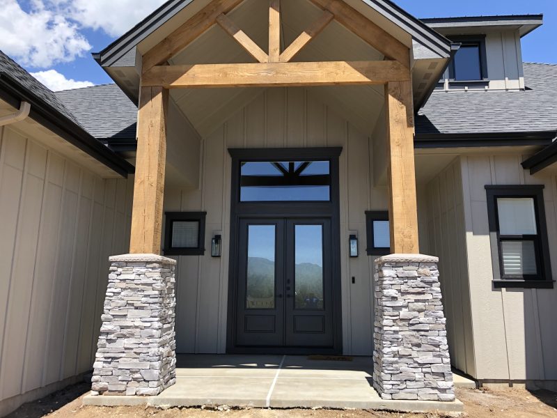front porch pillars and concrete-entry work (image 3)