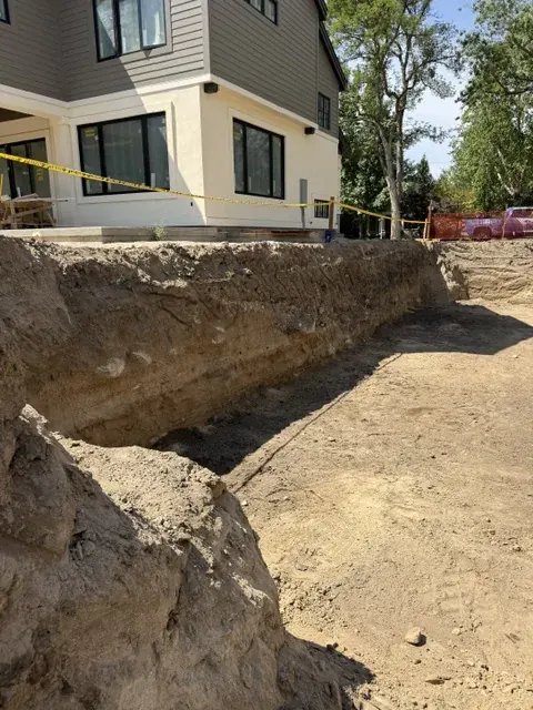 Chemical shoring excavation running along a home foundation